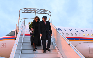 The Prime Minister arrives in Paris with his wife